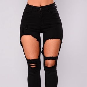 Distressed black skinny jeans
